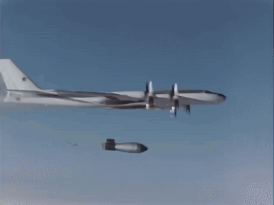 A Bomb Is Being Dropped From A Plane In The Air GIF