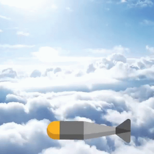 A Bomb Is Flying Through The Clouds In A Blue Sky . GIF