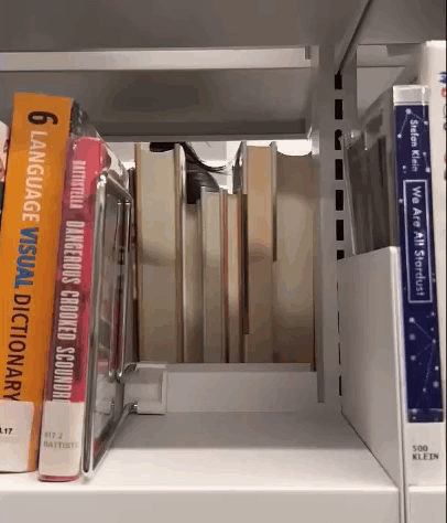 A Book Called 6 Language Visual Dictionary Sits On A Shelf With Other Books GIF