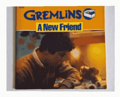 A Book Called Gremlins A New Friend Has A Picture Of A Man GIF
