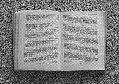 A Book Is Open To A Page That Says " I Am " GIF