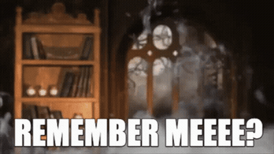 A Bookshelf In A Dark Room With The Words Remember Meeee Written On It GIF