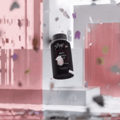 A Bottle Of Anti Dandruff Shampoo Is Falling In The Air GIF