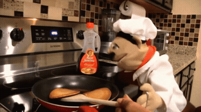 A Bottle Of Aunt Jemima Syrup Sits On The Stove GIF