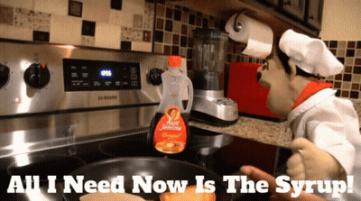 A Bottle Of Burt Jemima Syrup Sits On A Stove Top GIF