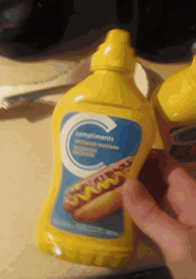 A Bottle Of Compliments Mustard Has A Picture Of A Hot Dog On It GIF