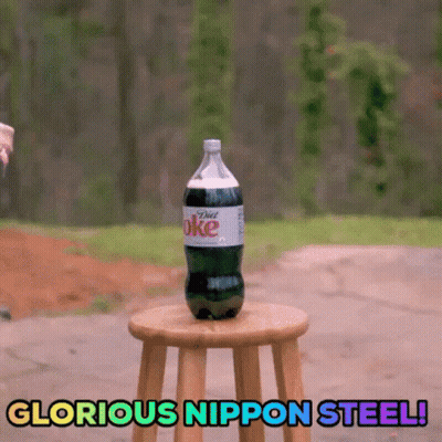 A Bottle Of Diet Coke Is Sitting On A Wooden Stool With The Words Glorious Nippon Steel Below It GIF