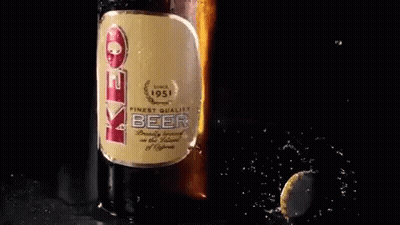 A Bottle Of Eve Beer Is Being Poured Into A Cup GIF
