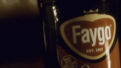 A Bottle Of Faygo Is Being Held By A Person GIF