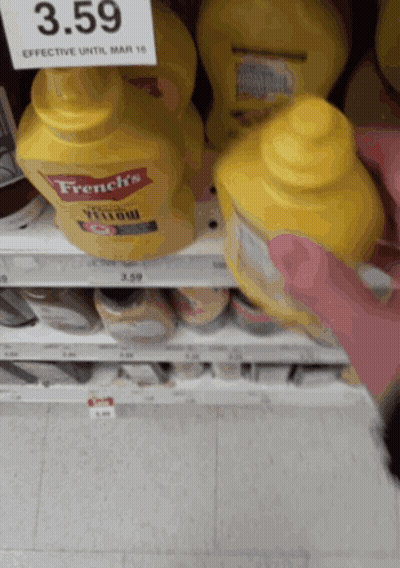 A Bottle Of French 'S Yellow Mustard Sits On A Shelf GIF