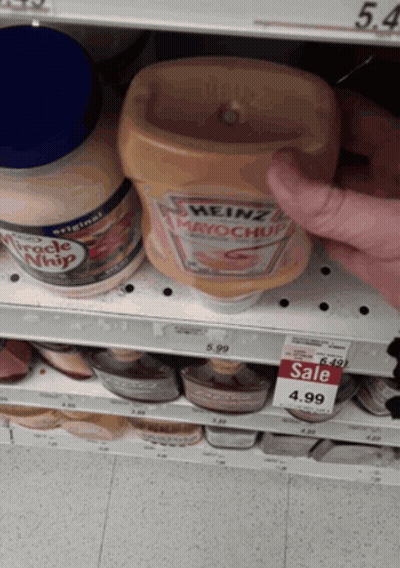 A Bottle Of Heinz Mayonnaise Sits On A Shelf In A Store GIF