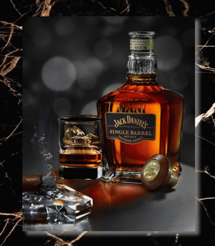 A Bottle Of Jack Daniel 'S Single Barrel Sits Next To A Glass Of Whiskey GIF