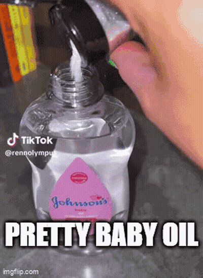 A Bottle Of Johnson 'S Baby Oil Is Poured Into Someone 'S Mouth GIF