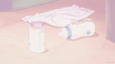 A Bottle Of Milk Sits On A Wooden Floor Next To A Towel GIF