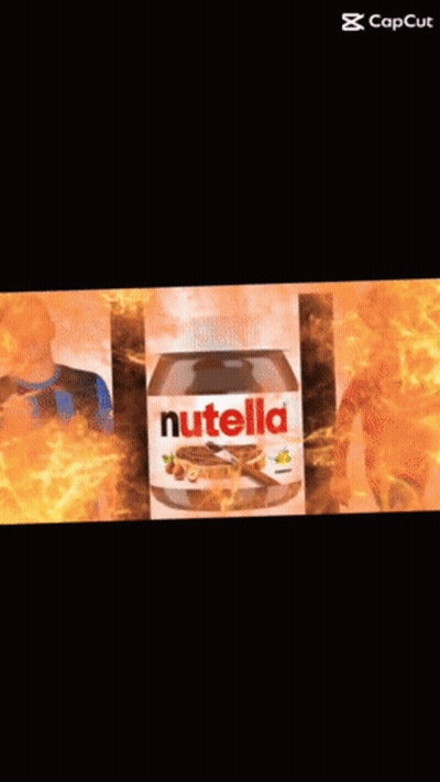 A Bottle Of Nutella Sits Next To A Boy In A Blue And Black Shirt GIF