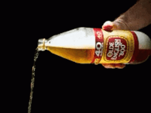 A Bottle Of Olde English 800 Is Being Poured Into Someone 'S Hand GIF