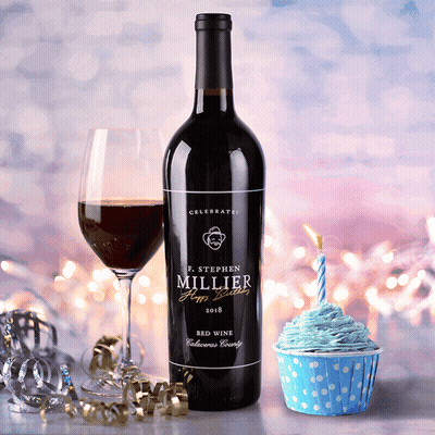 A Bottle Of P. Stephen Millier Red Wine Next To A Cupcake With Blue Frosting GIF