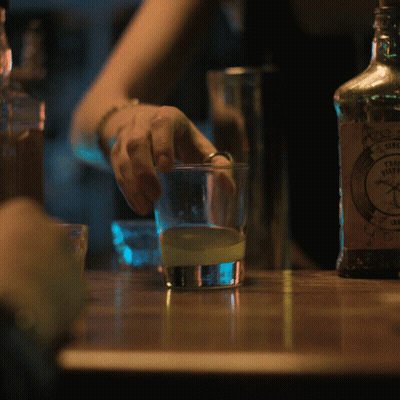 A Bottle Of Sierra Nevada Tequila Sits On A Wooden Table GIF