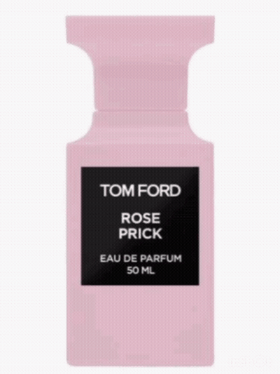 A Bottle Of Tom Ford Rose Prick Is Surrounded By Pink Roses GIF