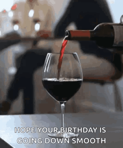 A Bottle Of Wine Is Being Poured Into A Glass With The Caption Hope Your Birthday Is Going Down Smooth . GIF