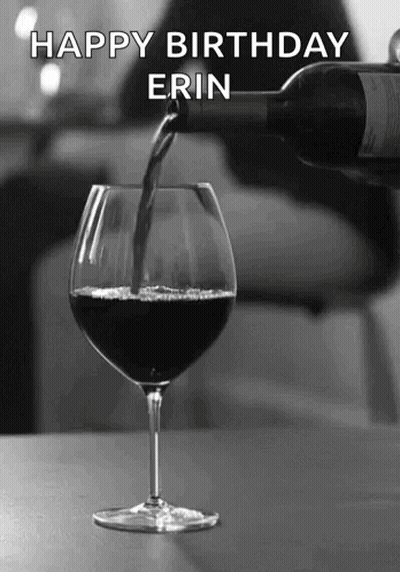 A Bottle Of Wine Is Being Poured Into A Glass With The Name Erin Written On The Bottom GIF
