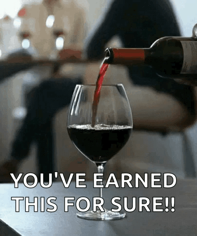 A Bottle Of Wine Is Being Poured Into A Glass With The Words " You 'Ve Earned This For Sure " Below It GIF