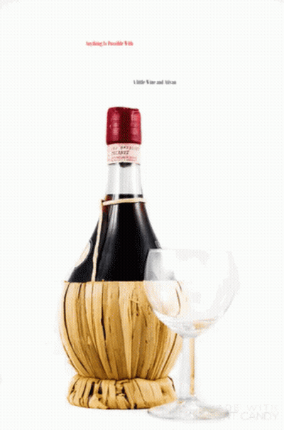 A Bottle Of Wine Is Wrapped In A Wicker Basket Next To A Wine Glass GIF