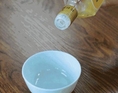 A Bottle With The Number 12 On It GIF
