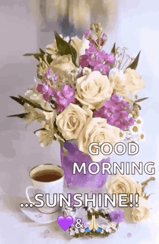 A Bouquet Of Flowers And A Cup Of Coffee On A Table With The Words `` Good Morning Sunshine '' Written On It . GIF