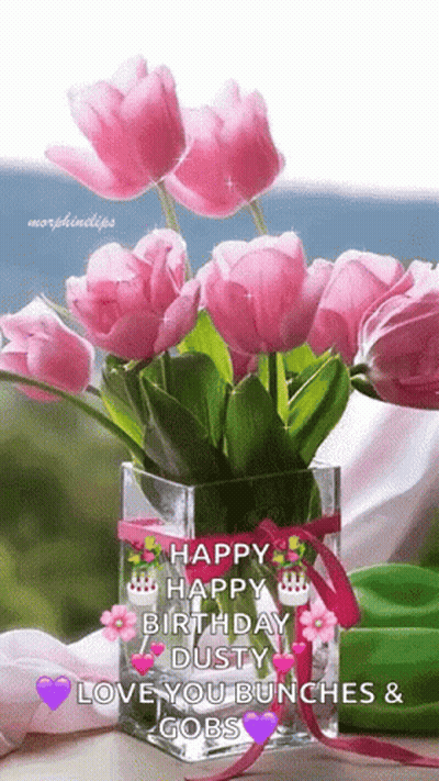 A Bouquet Of Pink Flowers In A Vase With The Words Happy Birthday Dusty Love You Bunches And Gobs On It GIF
