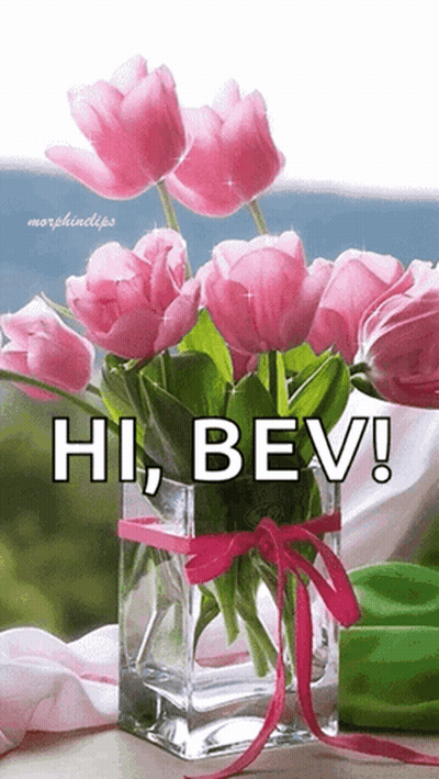 A Bouquet Of Pink Flowers In A Vase With The Words Hi Bev Written On It GIF