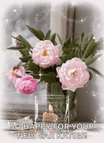 A Bouquet Of Pink Flowers In A Vase With The Words So Happy For Your New Car Katies On The Bottom GIF