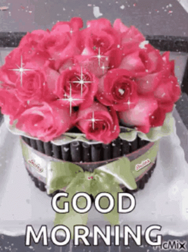 A Bouquet Of Pink Roses On A Cake With The Words `` Good Morning '' Written On It . GIF
