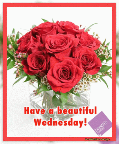A Bouquet Of Red Roses In A Glass Vase With The Words Have A Beautiful Wednesday GIF