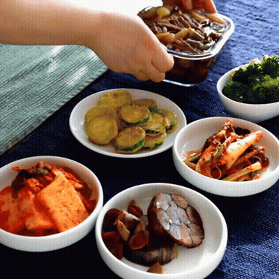 A Bowl Of Broccoli Sits On A Table Next To A Bowl Of Vegetables GIF