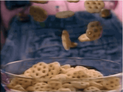A Bowl Of Cereal Is Being Poured Into A Glass GIF