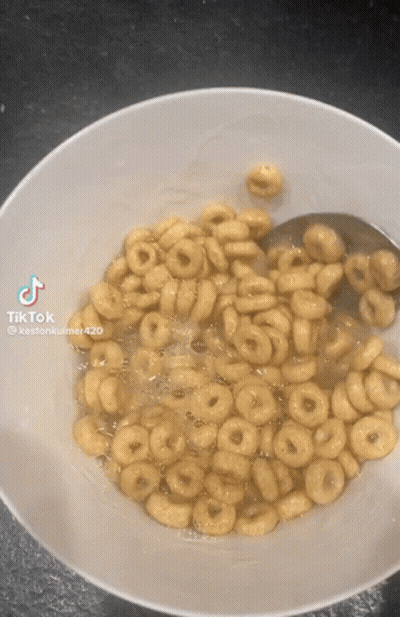 A Bowl Of Cereal With A Spoon In It Has A Tiktok Watermark On The Bottom GIF