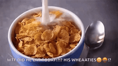 A Bowl Of Cornflakes With Milk Being Poured Into It . GIF