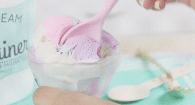 A Bowl Of Ice Cream With A Label That Says " Cream " GIF