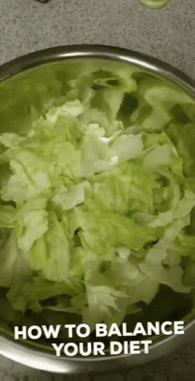 A Bowl Of Lettuce With The Words " How To Balance Your Diet " Written On It GIF