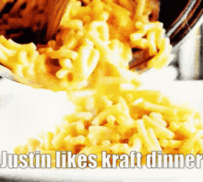 A Bowl Of Macaroni And Cheese Is Being Poured On A White Plate With The Caption Justin Likes Kraft Dinner GIF