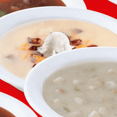 A Bowl Of Soup With Whipped Cream On Top GIF