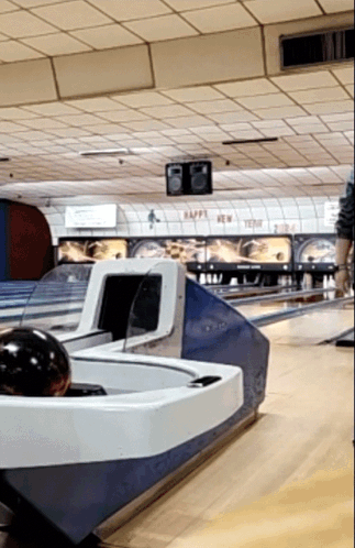 A Bowling Alley That Says Happy New Year On The Ceiling GIF