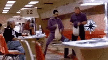 A Bowling Alley With A Sign That Says Number 22 GIF
