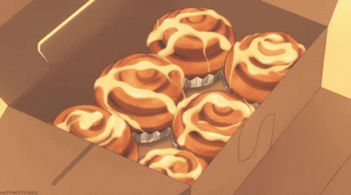 A Box Of Cinnamon Rolls Is Being Opened GIF