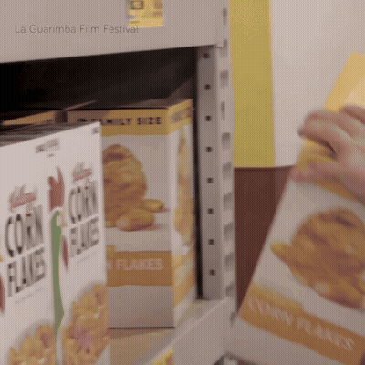 A Box Of Corn Flakes Sits On A Shelf At A La Guarimba Film Festival GIF
