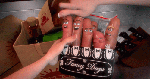 A Box Of Fancy Dogs Sits On A Countertop GIF