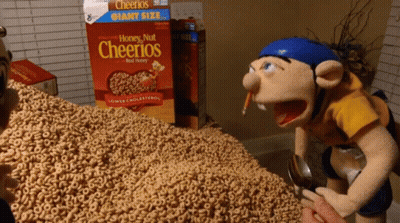 A Box Of Honey Nut Cheerios Sits On A Table GIF
