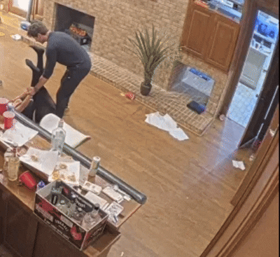 A Box Of Jack Daniels Sits On The Counter In A Messy Living Room GIF