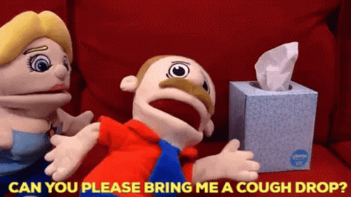 A Box Of Kleenex Sits Next To Two Puppets GIF